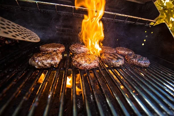 Raw gourmet burger patty ready for the grill, showcasing premium quality beef
