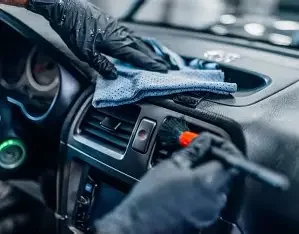 Premium car interior detailing with seats being professionally cleaned